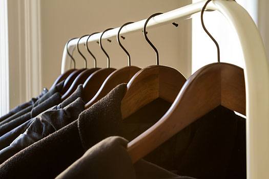 wooden-hangers-in-closet